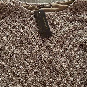 Taupe lined knit sweat with sequin embellishment.